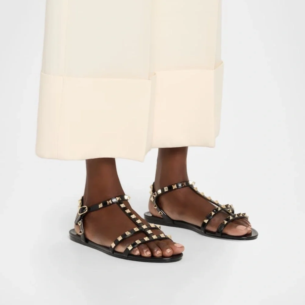 Damaged Valentino Garavani Rockstud Jelly Flat Gladiator Sandals in Black
